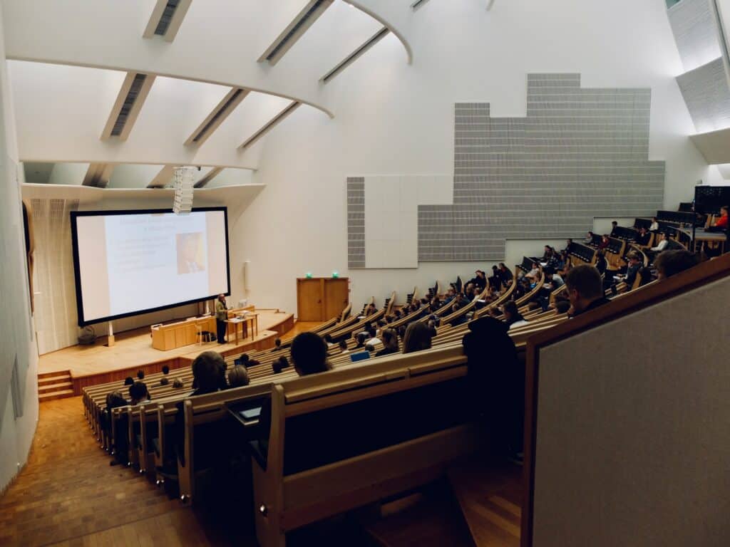 Shot from insider a lecture hall of a university Photo by Dom Fou on Unsplash